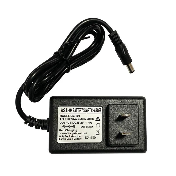 A black charger for the 101 Pickleball Launcher, having specification and charging capability written on its label.
