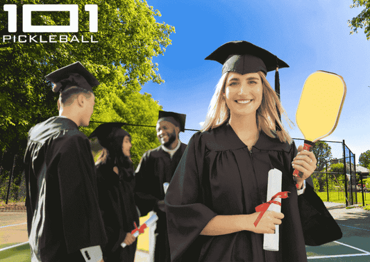 Students graduating while holding a diploma and pickleball paddle. 