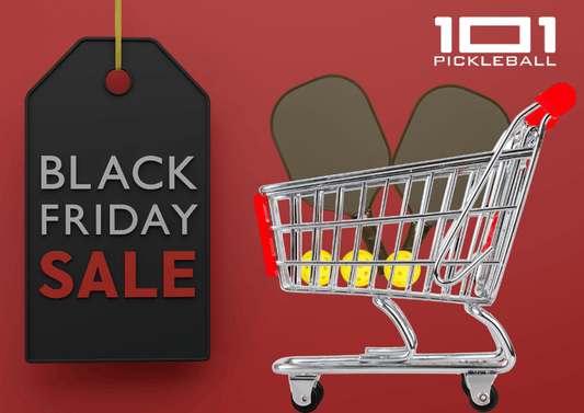 Black friday sale sign with a cart full of pickleball equipment.