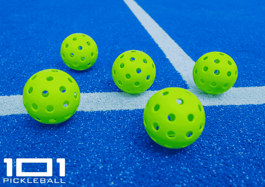 Pickleballs on the court ground